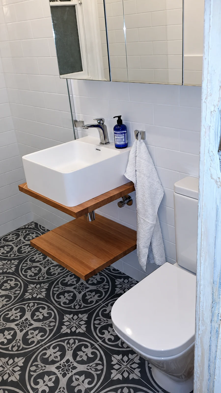 Bathroom vanity, basin and toilet fixtures.